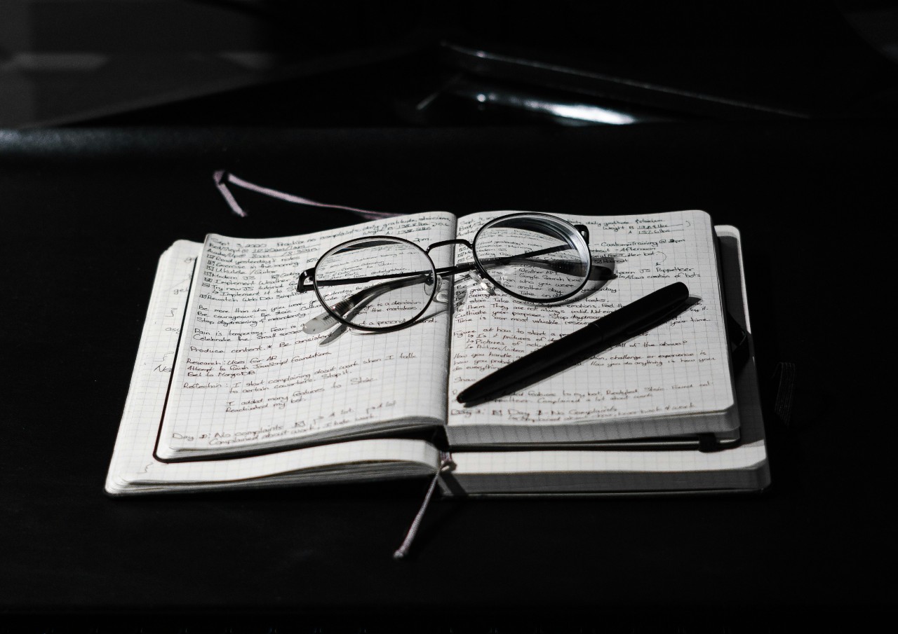 Editing for word choice photo of glasses, pen and book