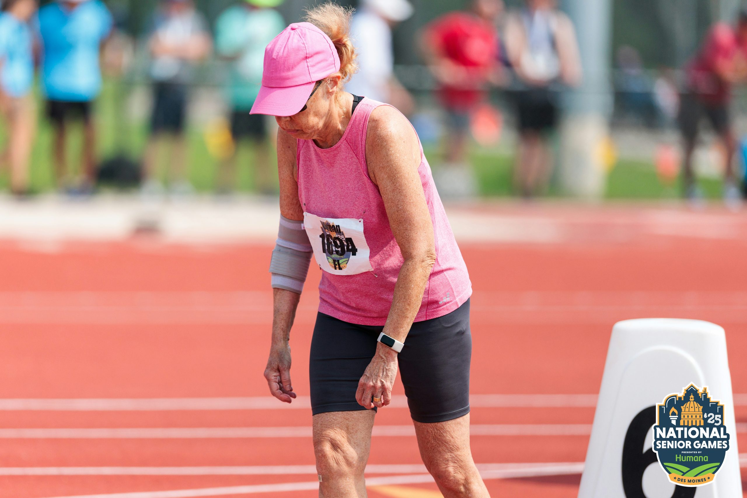 Woman getting ready to run a race on a track